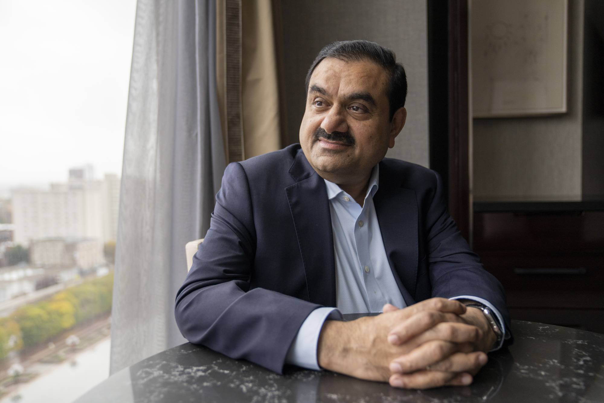 Gautam Adani, the founder India’s Adani Group, whose net worth of $120 billion makes him the richest person in Asia, at a hotel suite in Boston on Oct. 26, 2022. (M. Scott Brauer/The New York Times)