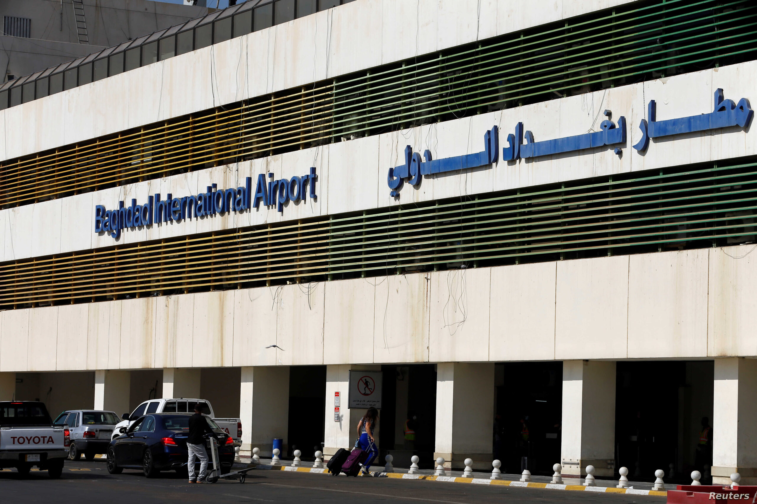 Passengers arrive to Baghdad International Airport, where flights halted due to the coronavirus disease (COVID-19) outbreak, after it's reopening, in Baghdad